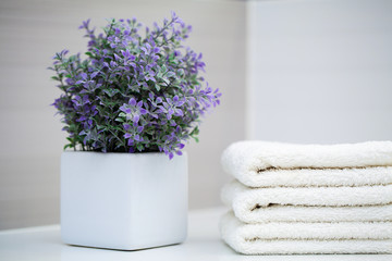 White towels on white table with copy space on bath room background