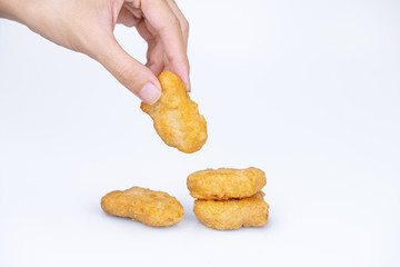 hand holding nuggets fast food 