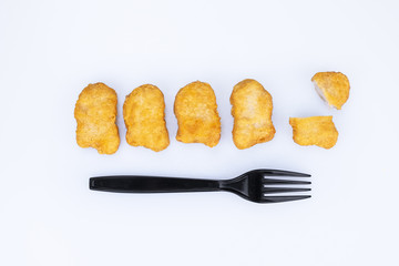 fries nuggets with black frog on isolate white background