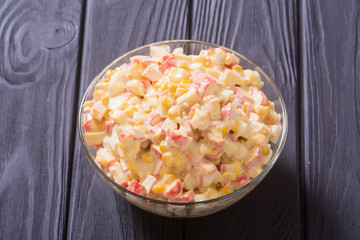 Salad with crab sticks , corn , eggs and mayonnaise
