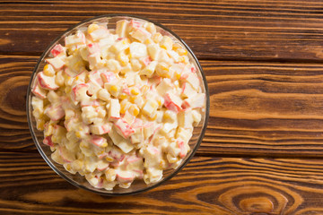 Salad with crab sticks , corn , eggs and mayonnaise
