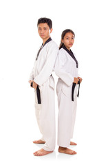Taekwondo couple stand back at each other full length