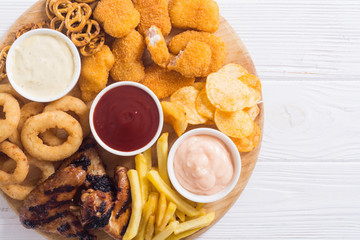 Onion rings , nuggets grilled wings , french fries and mix of snacks