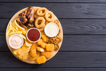 Onion rings , nuggets grilled wings , french fries and mix of snacks
