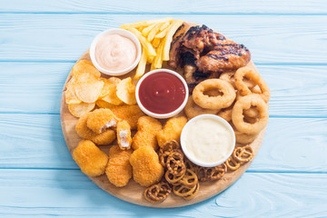 Onion rings , nuggets grilled wings , french fries and mix of snacks