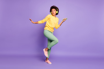 Full length body size view of nice attractive charming dreamy funky funny cheerful wavy-haired girl listening soul dancing having fun isolated over violet purple lilac pastel color background