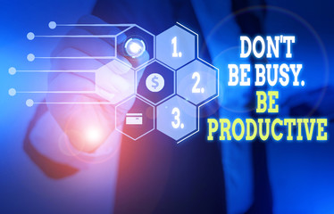 Text sign showing Don T Be Busy Be Productive. Business photo text Work efficiently Organize your schedule time Woman wear formal work suit presenting presentation using smart device