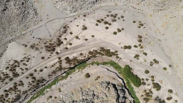 Arial footage of "Finca de Chañaral" an oasis used by the Incas on their Inca Trail for resting and get some water since is the unique oasis in the area at 1,500masl. A rugged canyon inside the Andes
