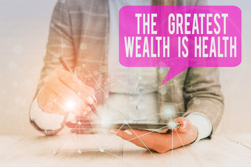 Word writing text The Greatest Wealth Is Health. Business photo showcasing being in good health is the prize Take care Female human wear formal work suit presenting presentation use smart device