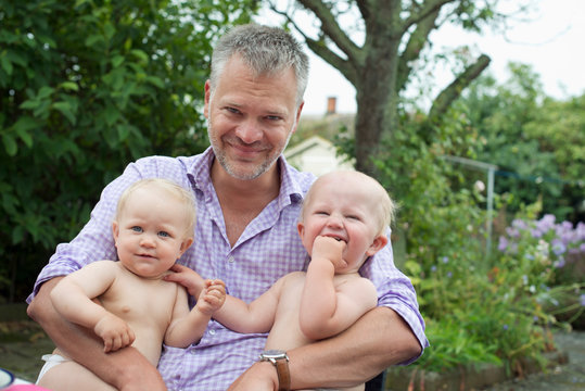 Man holding his children