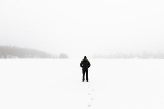 Man in snow covered field