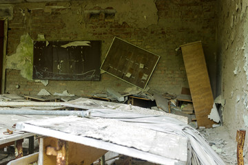The ruins of the school. The destroyed class in the school Chernobyl exclusion zone.
