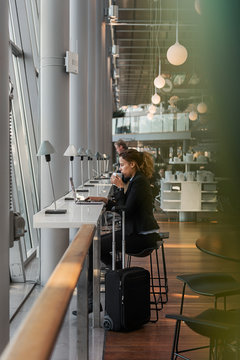 Woman using laptop in airport