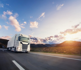 Obraz na płótnie Canvas European truck vehicle with dramatic sunset light