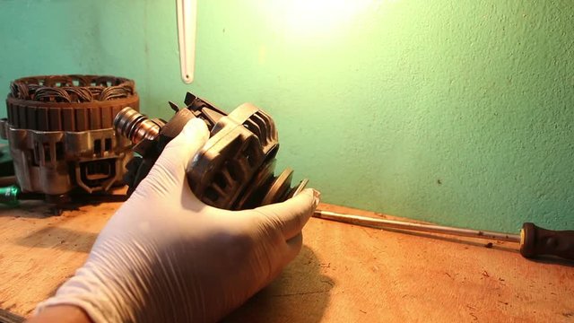 Repair Alternator of a car. Checking shot.