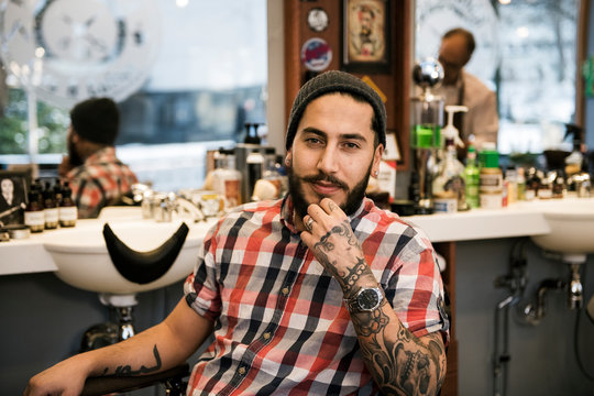Portrait of barber sitting in barber?s chair