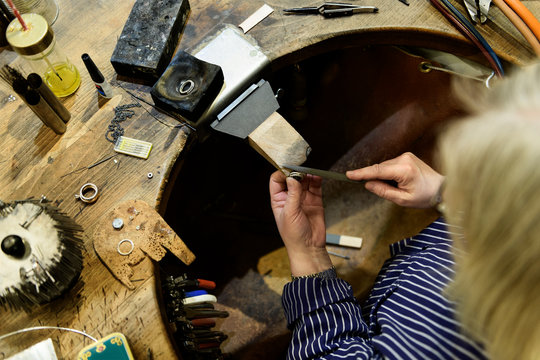 Goldsmith working on ring