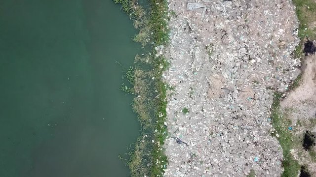 Aerial view rubbish beside the Sungai Juru river bank, Penang, Malaysia.