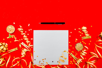 Notebook and Gift box with golden bow on festivel background with stars and sparkles wish list . New year resolution concept copyspace top horizontal view. Sticky tape, Christmas balls