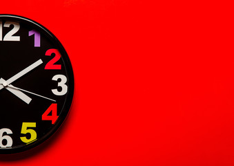 colored wall clocks show time