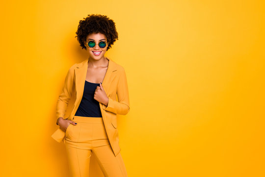 Portrait of confident cool sweet pretty dark skin girl dream feel content expressions wear stylish outfit isolated over yellow color background