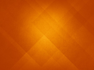 Orange abstract  autumn or fall background colors in classy elegant block and triangle shape geometric pattern design with soft lighting and faint vintage paper texture