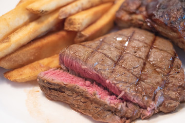 Rib eye Steak and Ribs with Potato Fries.