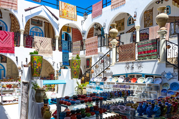 Tunisia. (Southern Tunisia). Island of Djerba. Houmt Souk. Souvenir shop for tourists in the medina - obrazy, fototapety, plakaty