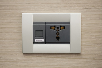 Universal Wall Socket with LAN cable Internet connection in a hotel room.