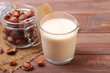 Hazelnut milk on the table. Vegetable milk, Vegetarian milk.