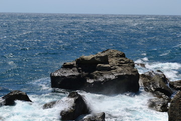 rock in the sea and waves