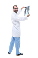 in full growth. doctor therapist looking at the x-ray