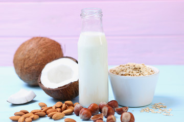 Different types of vegetable milk on the table. Coconut, oatmeal, hazelnut, almond milk. Vegetarian milk.