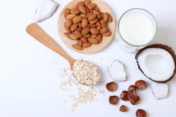 Different types of vegetable milk on the table. Coconut, oatmeal, hazelnut, almond milk. Vegetarian milk.