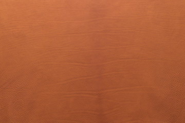 Orange-brown grainy, heavy grain calf cow leather texture and background.