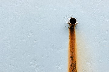 Old iron pipe on cement wall with rusty , copy space.
