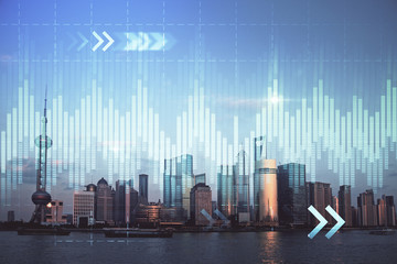 Forex graph on city view with skyscrapers background double exposure. Financial analysis concept.