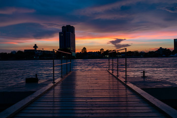 Boat Dock on river with Beautiful Sunset Twilight Time Background. Landscape Concept.