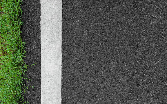 Surface grunge rough asphalt black dark grey road street and green grass texture Background,empty copy space,Top view abstract Seamless tarmac