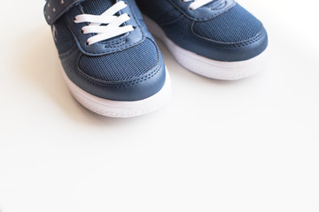 Kid s sport shoes. Isolated on white background with clipping path.pair of blue and white sneakers on white. kids fashion. Trendy shoes.children's sports sneakers, casual shoes