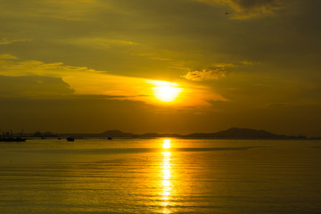 sunset over the ocean with dramatic cloudscape.