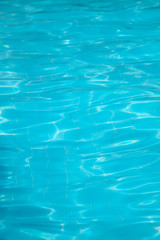 A close-up of sun reflections in pool water