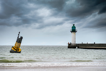 cardinal buoy stranded on the beach