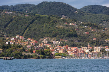 Fototapeta na wymiar view on Fezzano city and mountains. Fezzano is located in La Spezia, Liguria, close to world famous Cinque Terre. Italy, Europe