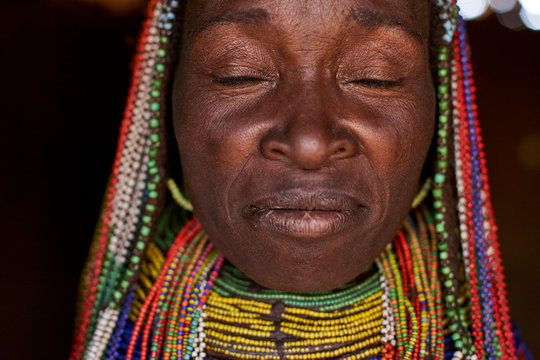 Muhila woman with her characteristic hairstyle and necklaces, Congolo, Angola