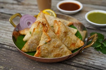 Homemade Samosas wiith Chutneys/Diwali snacks, selective focus