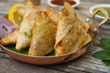 Homemade Samosas wiith Chutneys/Diwali snacks, selective focus