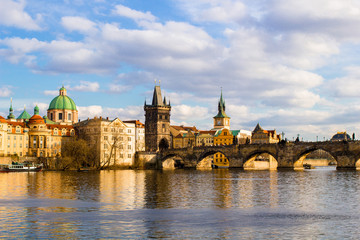 Fototapeta na wymiar Spring sunset in Prague, view on the Vltava river and Charles Bridge