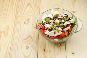 Glass bowl with Greek salad