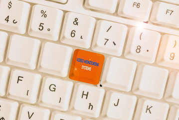 Text sign showing Video Monitoring Systems. Business photo showcasing Surveillance Transmit capture Image to Digital Link White pc keyboard with empty note paper above white background key copy space